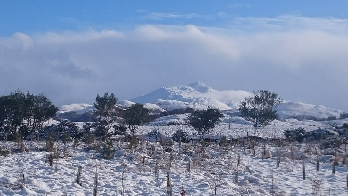 View of Ben Resipole behind caravans in winter, Ardnamurchan Scotland